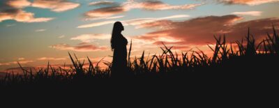 One woman enjoying the sunset
