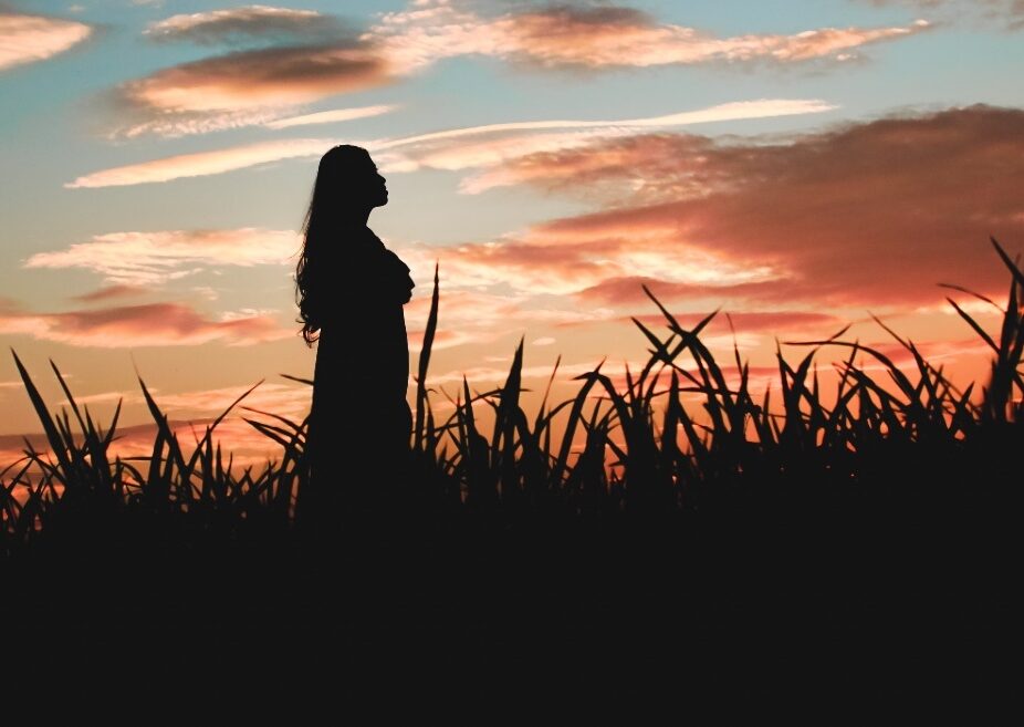 One woman enjoying the sunset
